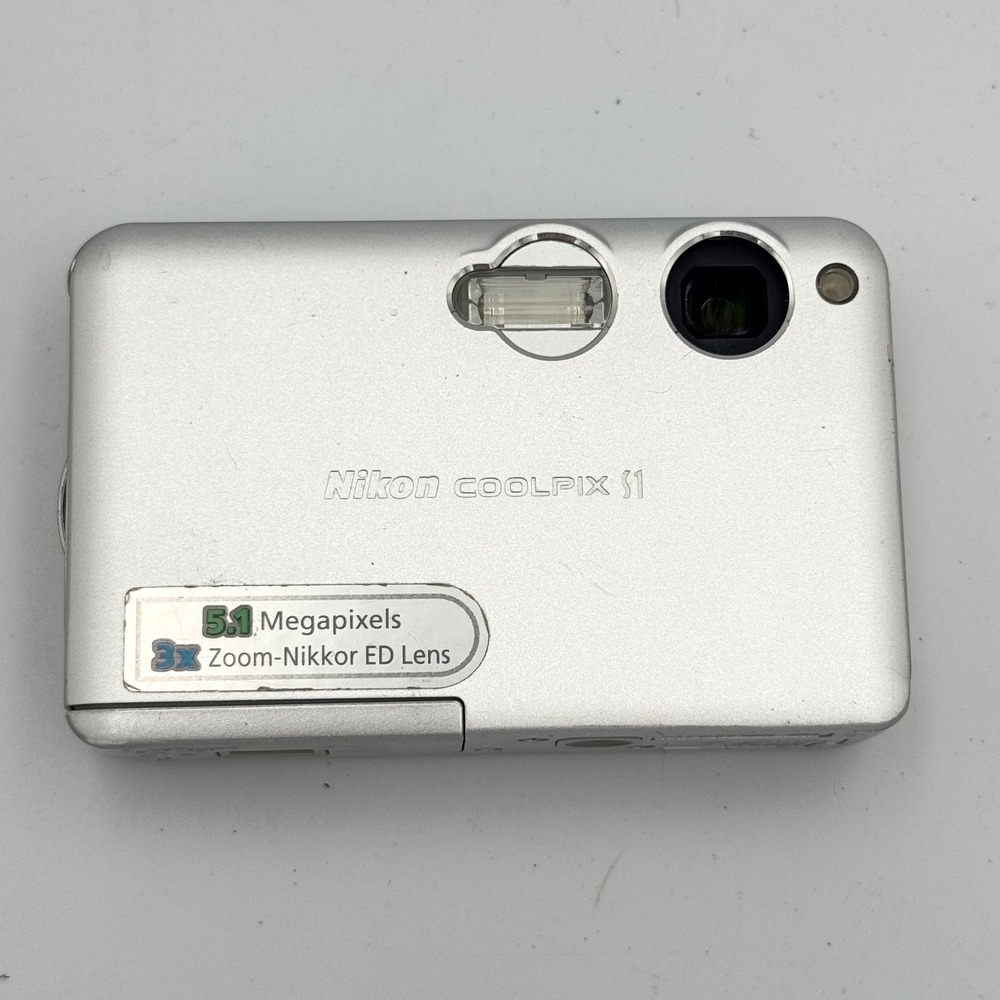 Nikon Coolpix S1 5.1MP Digital Camera Silver Bundle with Dock and AC Adapter